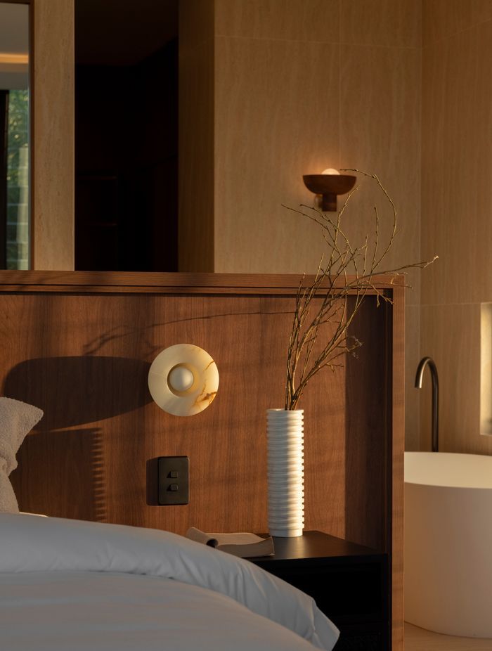 The master is warm and textural with a beautiful material selection.