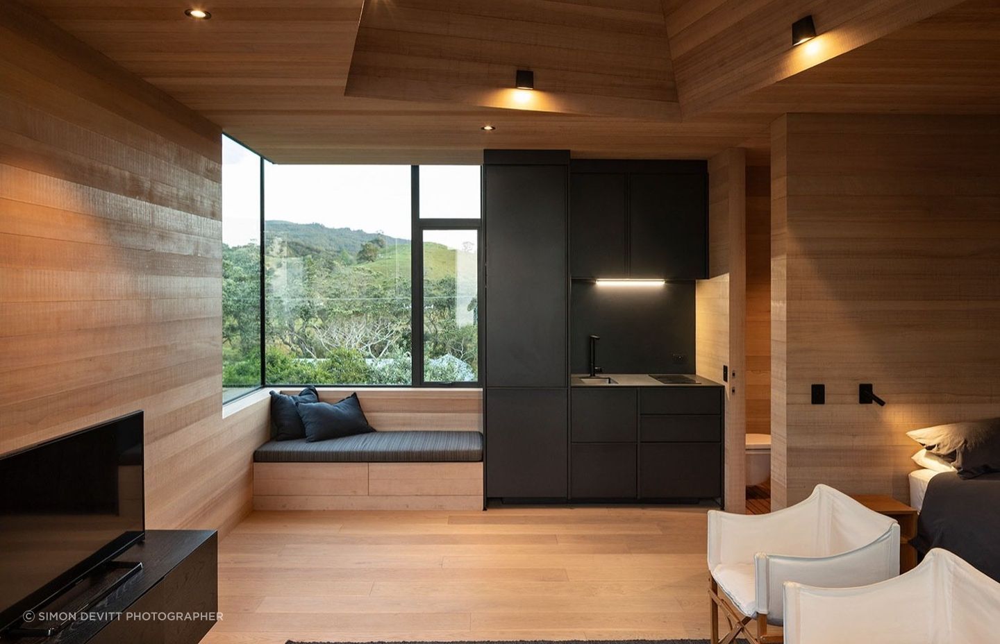 A window seat offers an opportunity to laze, feet up, in the company of a good book.