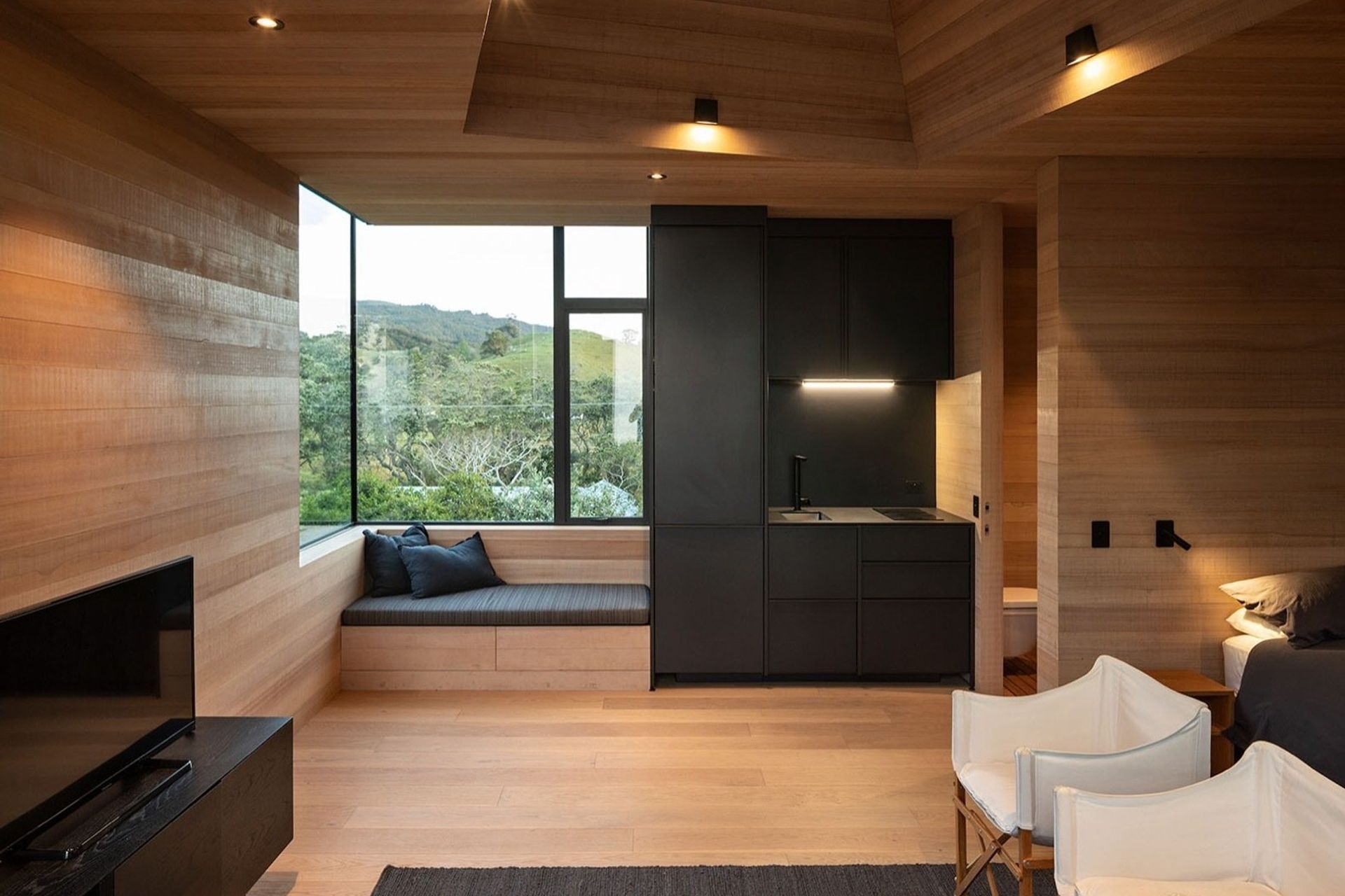 A window seat offers an opportunity to laze, feet up, in the company of a good book.