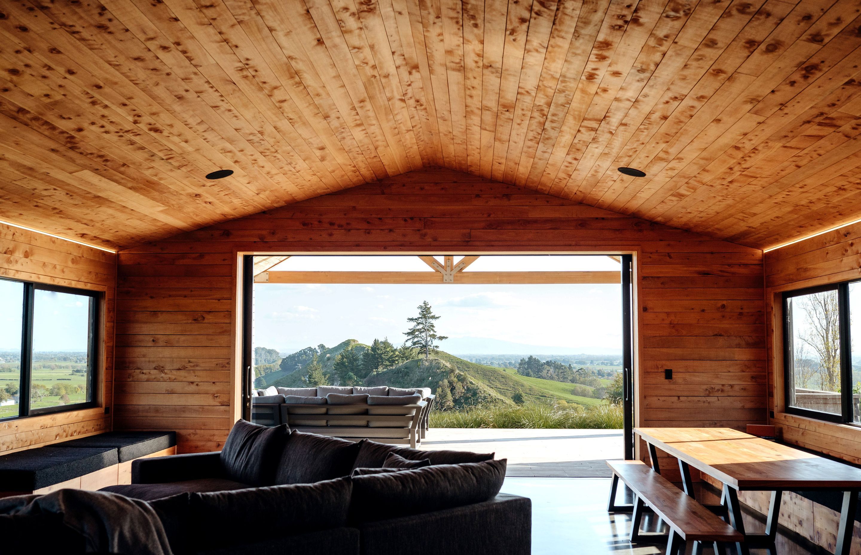 The large living area, looking out to the surrounding hills.