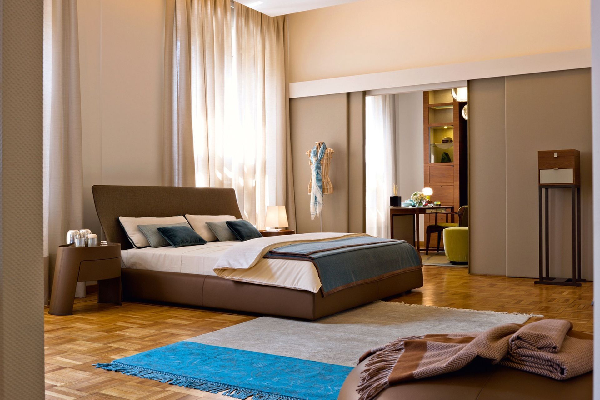 The Altea Bed with profiled headrest by Georgetti is the epitome of modern luxury.