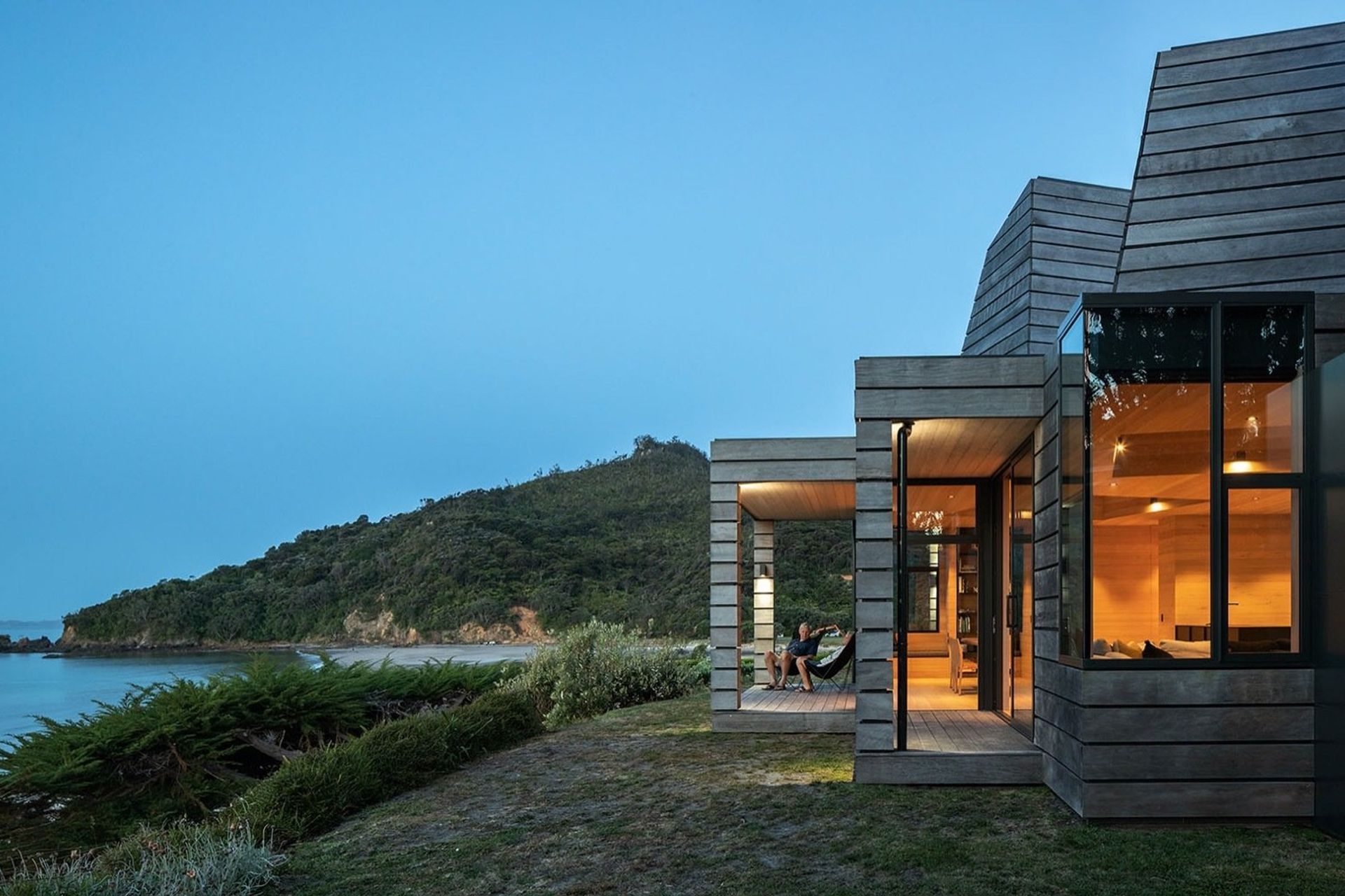 The external timber cladding is rough and reclaimed, while inside, hemlock lining and oak flooring provide warmth.