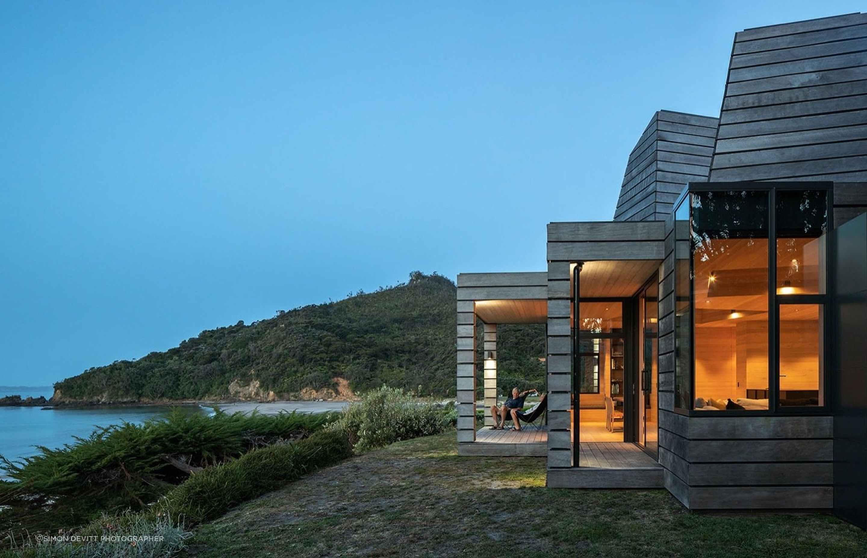 The external timber cladding is rough and reclaimed, while inside, hemlock lining and oak flooring provide warmth.