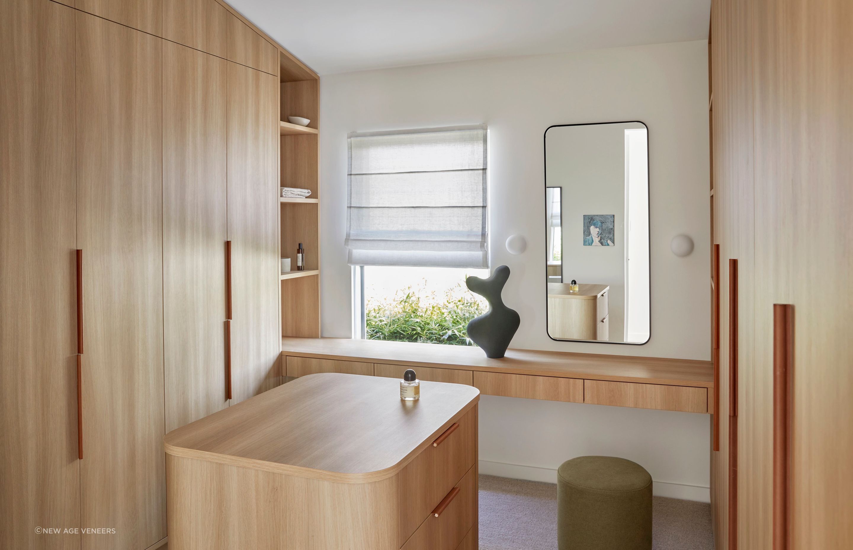 Freshwater, Northern Beaches NSW:
Interior designer Jacqui Koska enlisted Streamlined Kitchens joinery for this statement curved island in the dressing room using Navurban Diamond in white mountain oak.