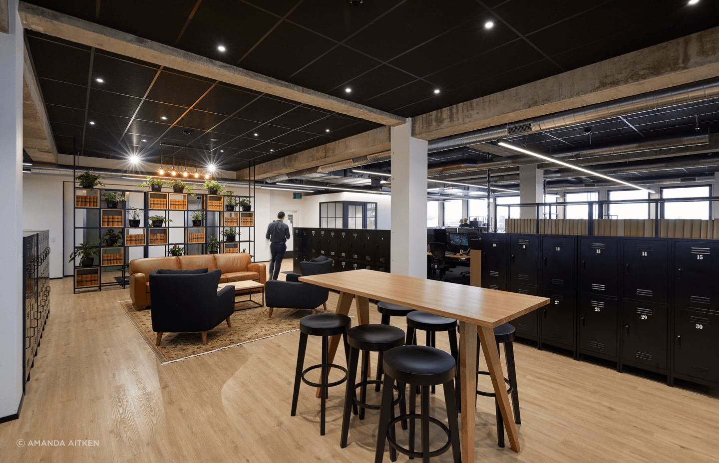 On the floor below, a modern industrial aesthetic was embraced, with concrete forms and timber beams left exposed.