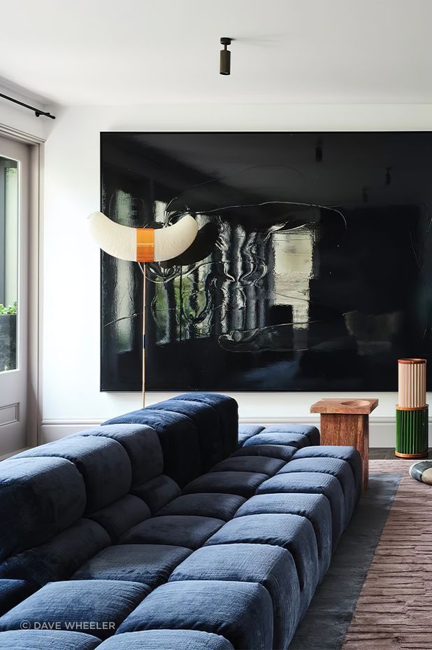In the entertaining hub of the home an oversized Tufty-Time sofa by Patricia Urquiola for B&B Italia, sourced from Space Furniture, introduces effortless comfort and a modern silhouette.