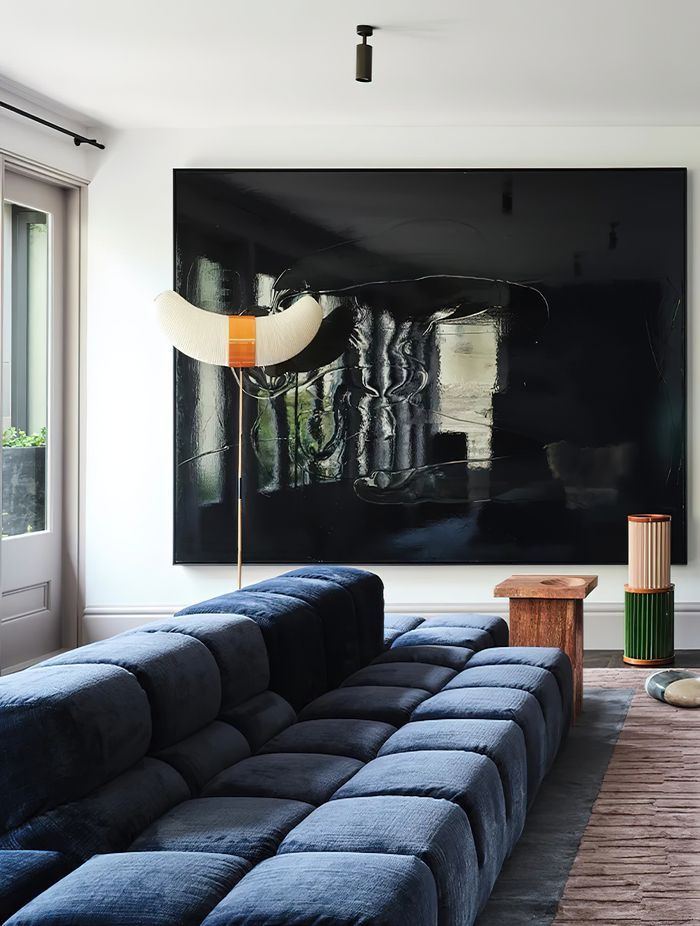 In the entertaining hub of the home an oversized Tufty-Time sofa by Patricia Urquiola for B&B Italia, sourced from Space Furniture, introduces effortless comfort and a modern silhouette.
