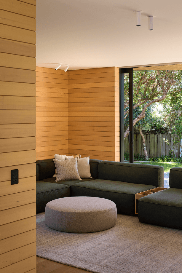 The downstairs lounge area effortlessly connects with the outdoors.