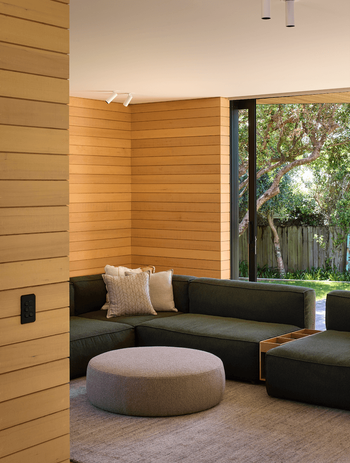 The downstairs lounge area effortlessly connects with the outdoors.