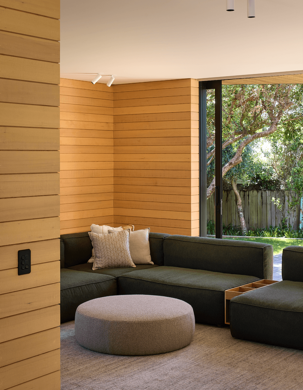 The downstairs lounge area effortlessly connects with the outdoors.