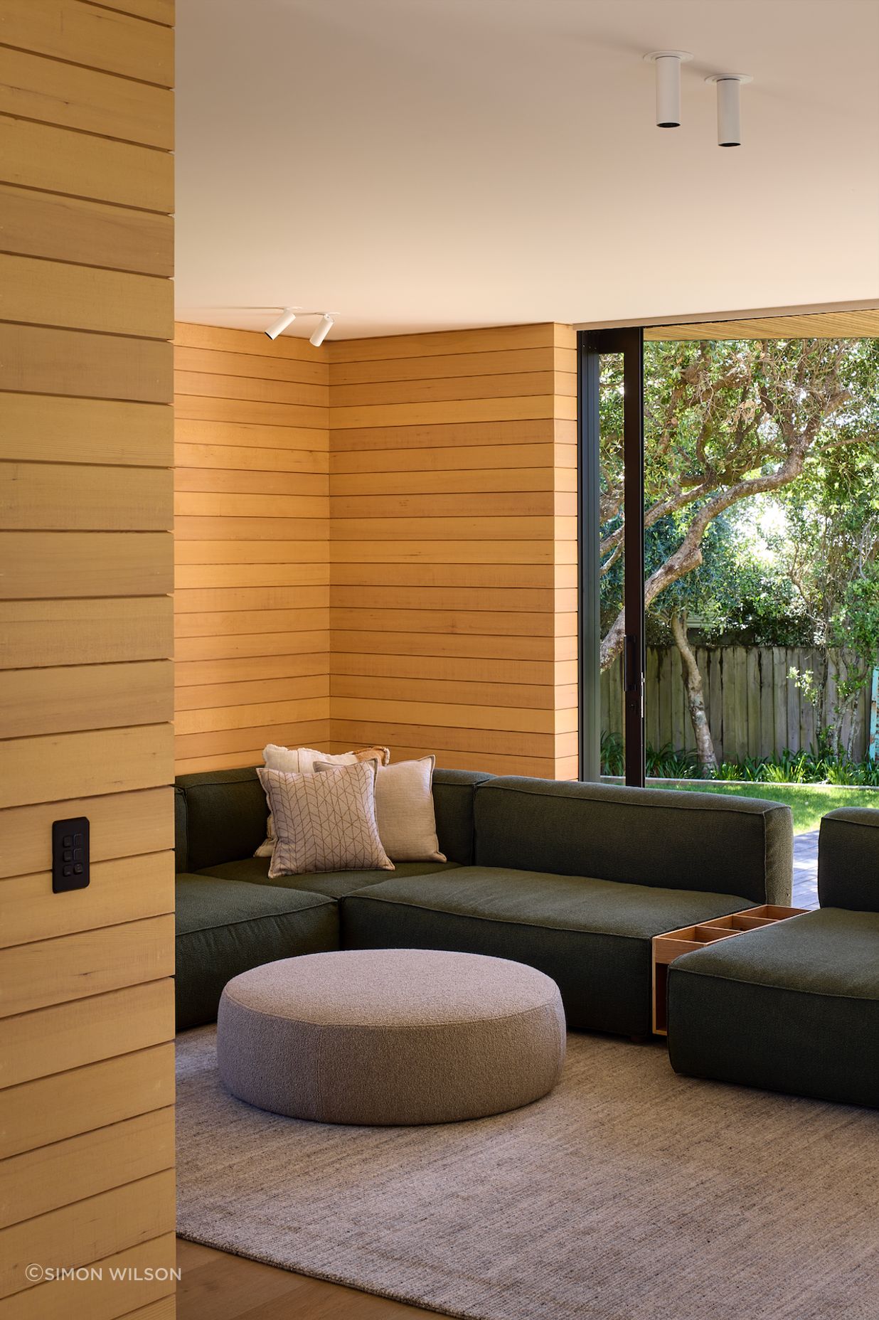 The downstairs lounge area effortlessly connects with the outdoors.