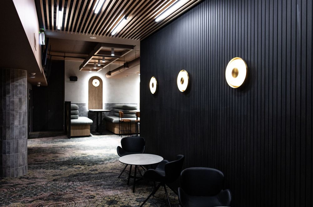 Screenwood's PANELS in Groove 50 line the walls to create a sophisticated yet relaxed atmosphere.