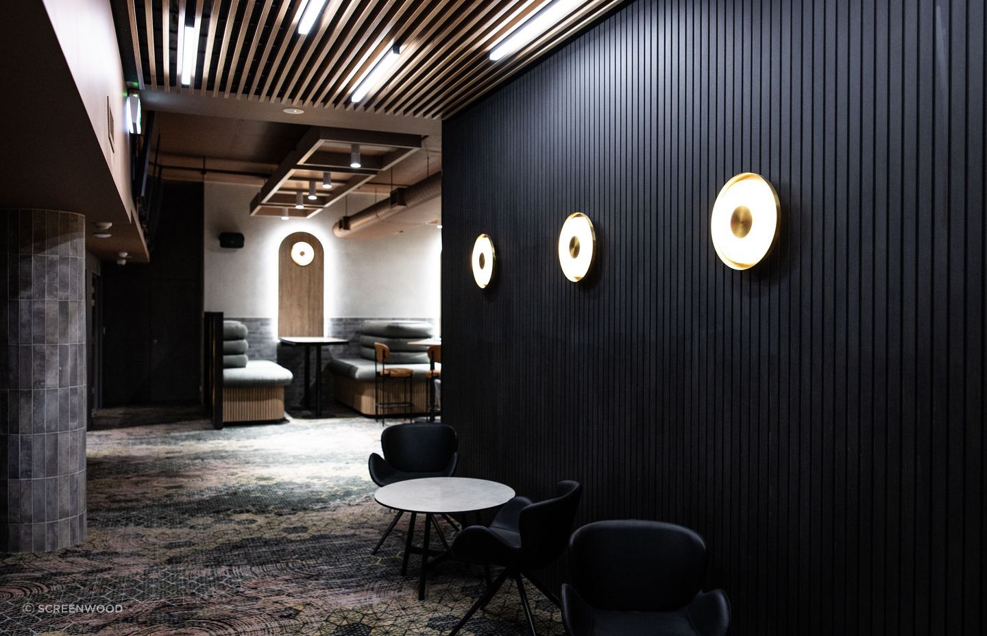 Screenwood's PANELS in Groove 50 line the walls to create a sophisticated yet relaxed atmosphere.