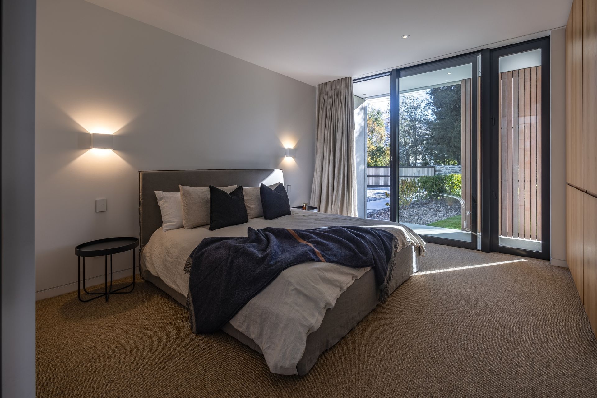 Bedrooms are minimal in reflection of their primary purpose, favouring a connection to the outdoors.