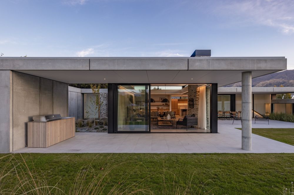 Beneath the concrete veneer, a layer of timber framing is hidden, filled with insulation to warm occupants.