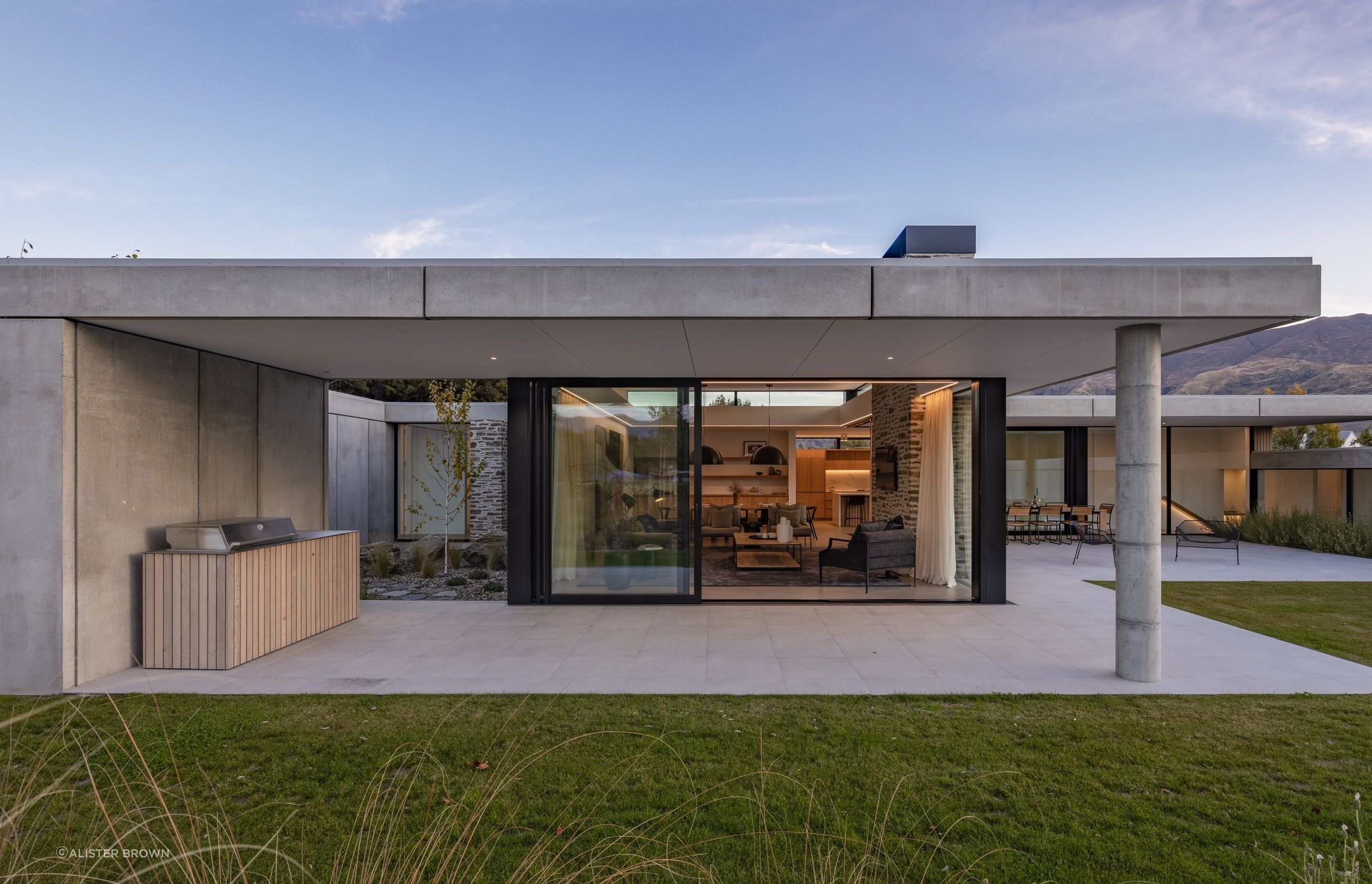 Beneath the concrete veneer, a layer of timber framing is hidden, filled with insulation to warm occupants.