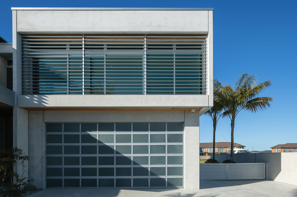 Boxed formations and concrete surfaces define this architectural build.