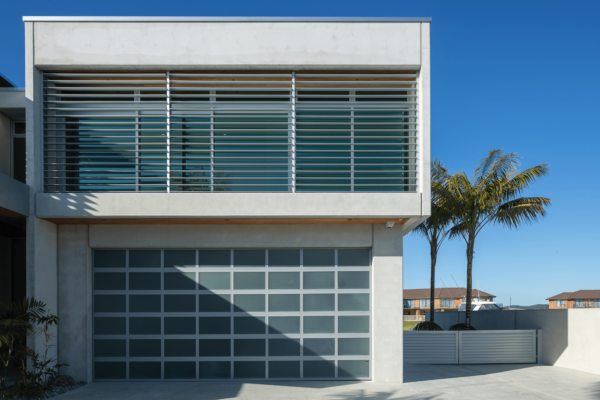 Boxed formations and concrete surfaces define this architectural build.