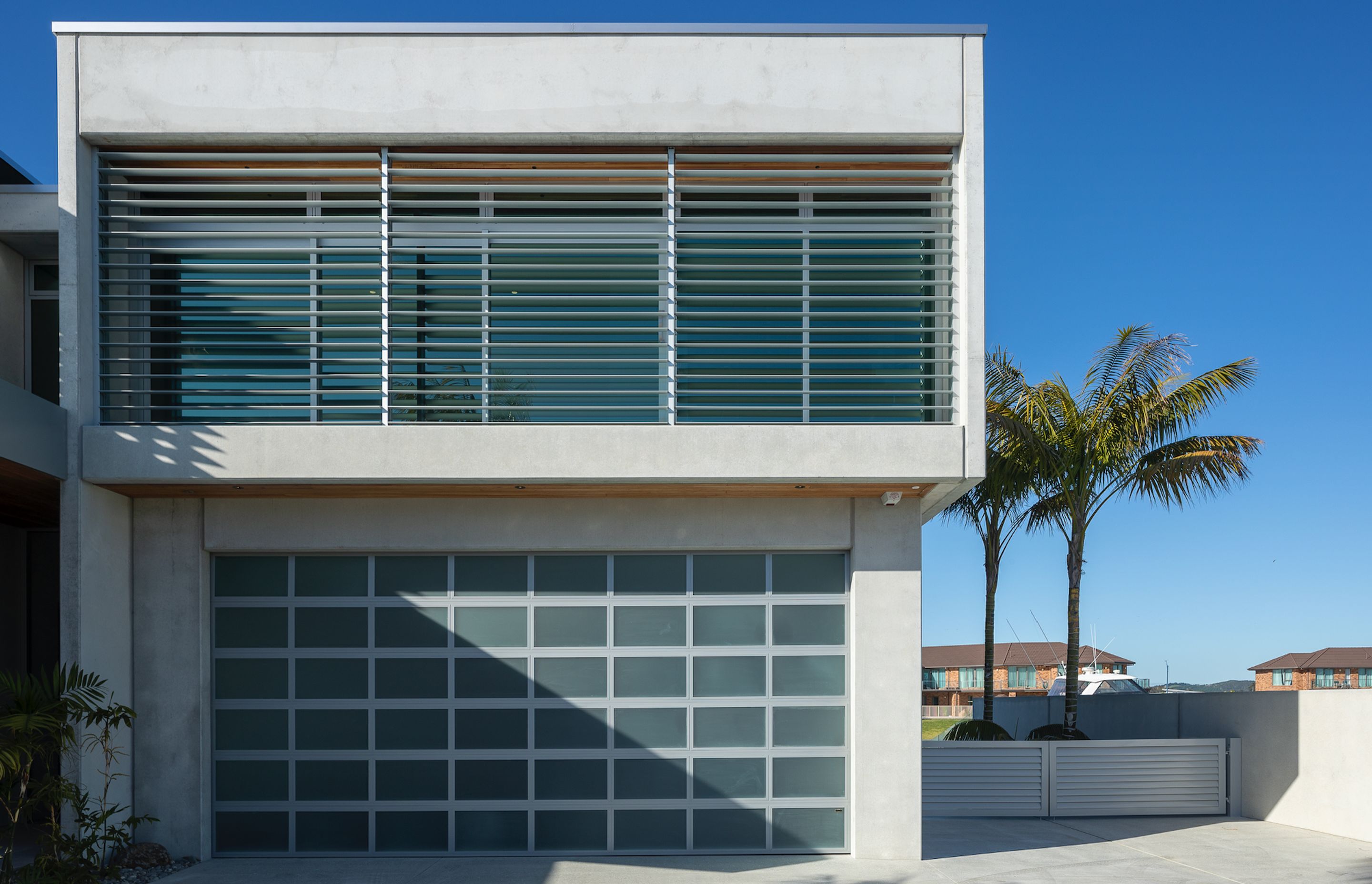 Boxed formations and concrete surfaces define this architectural build.