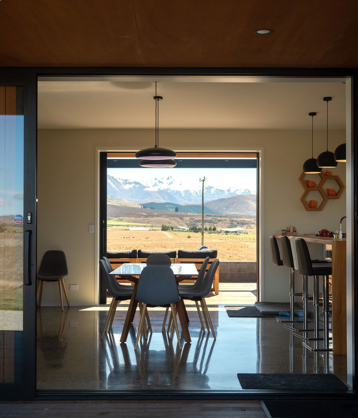 The view through the living area. “The architectural experience is quite a long journey,” says Beth. “It's about getting to know clients really well, early on, so we spent the time up front actually getting to know the clients and their unique needs and lifestyles.”