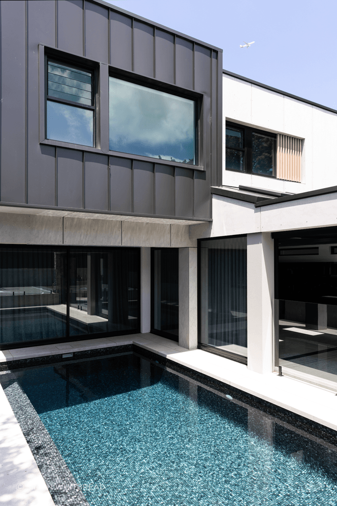 The pool is easily accessed from the indoor-outdoor entertainment area.