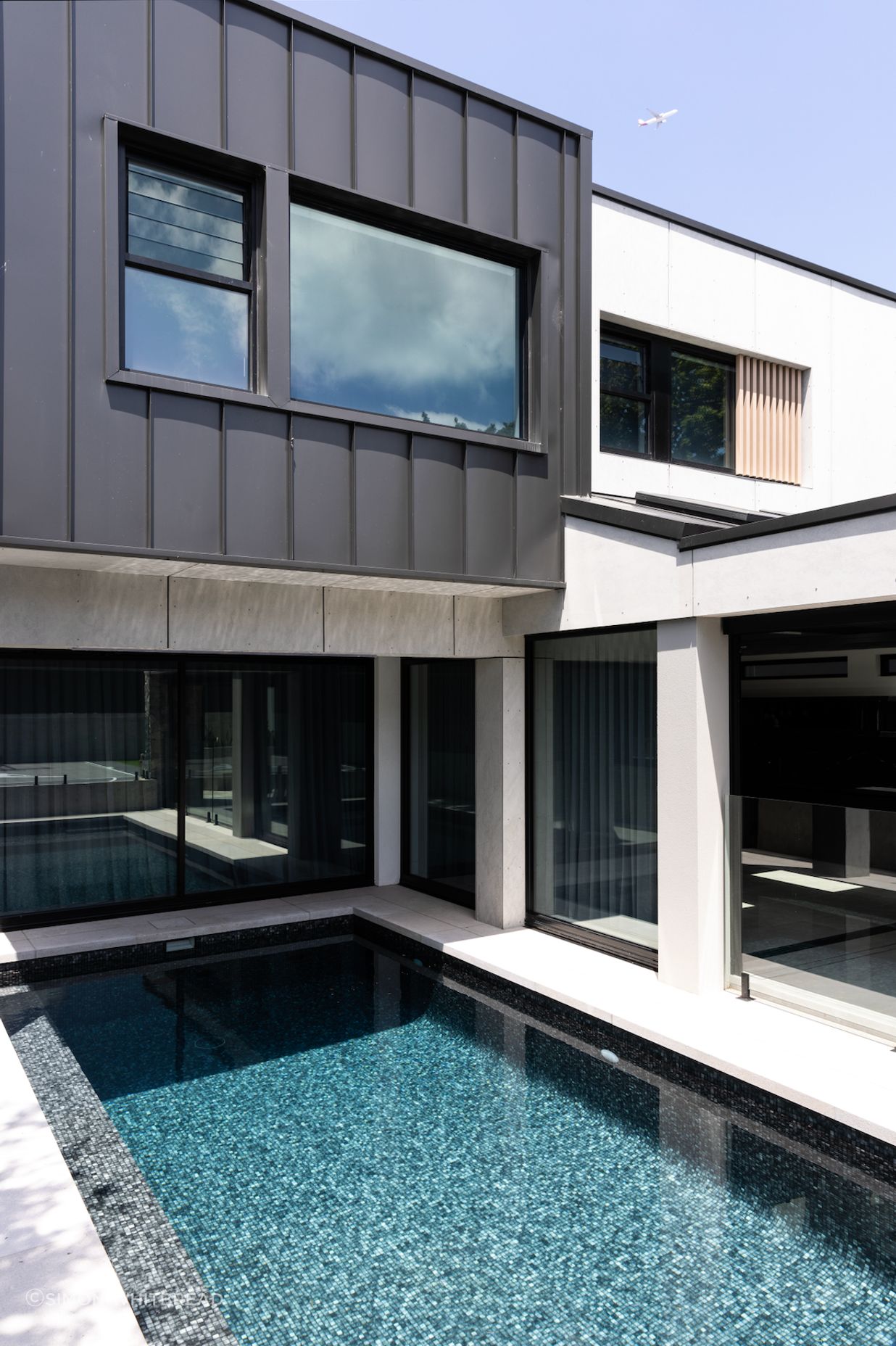 The pool is easily accessed from the indoor-outdoor entertainment area.