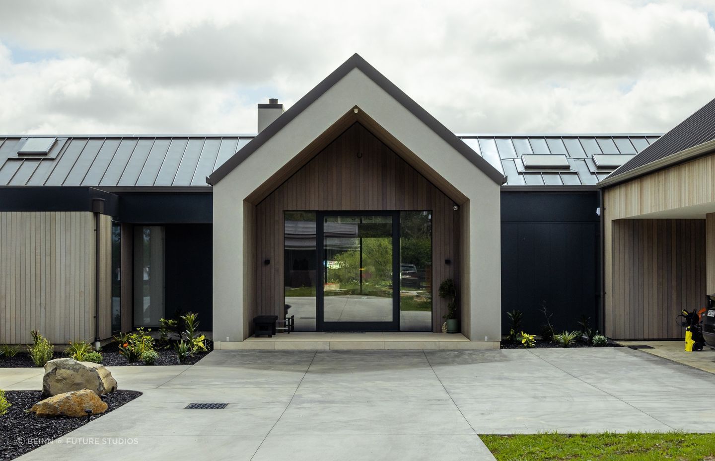 The forecourt features carefully considered planting.