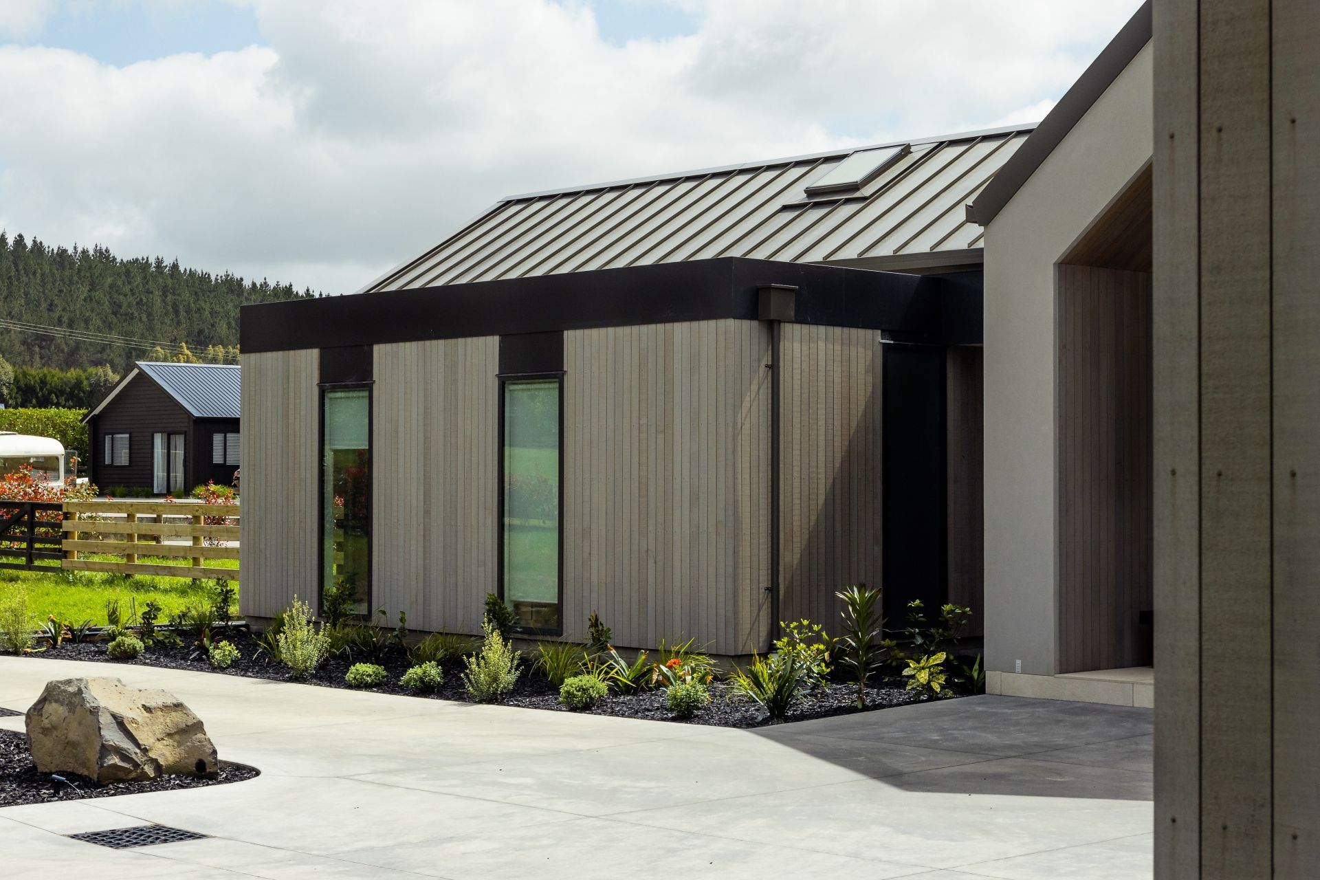 A exterior features a combination of NuWall, Espan and cedar.
