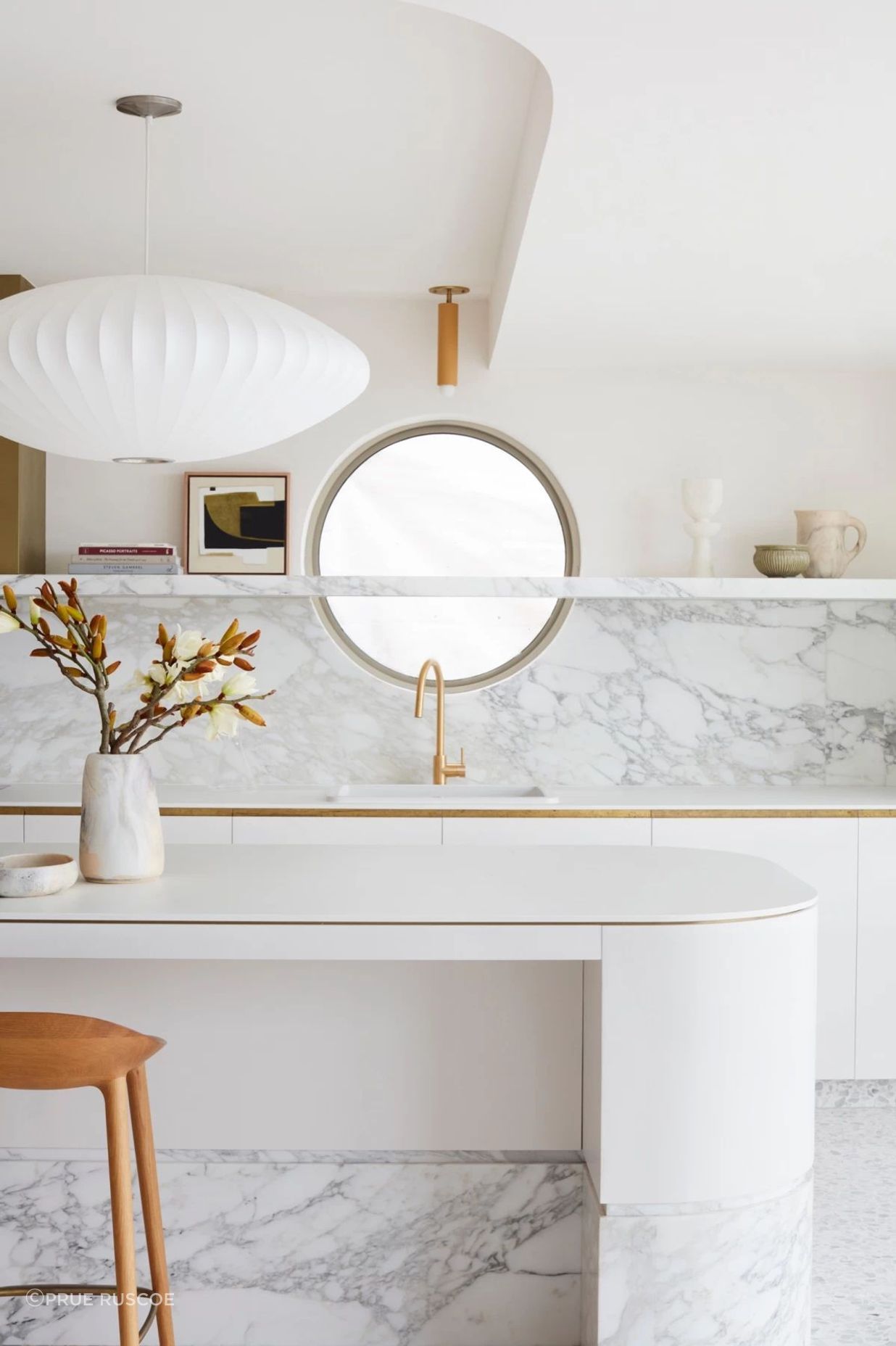 The round window in the kitchen is a reference to the home's original windows.