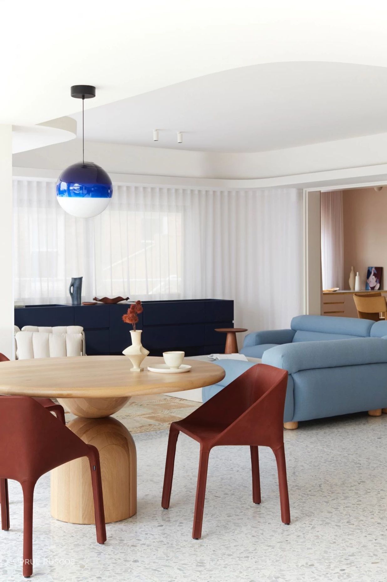 The terrazzo floor acts as a gorgeous canvas for the furniture to deliver a contemporary twist on 1980s style.
