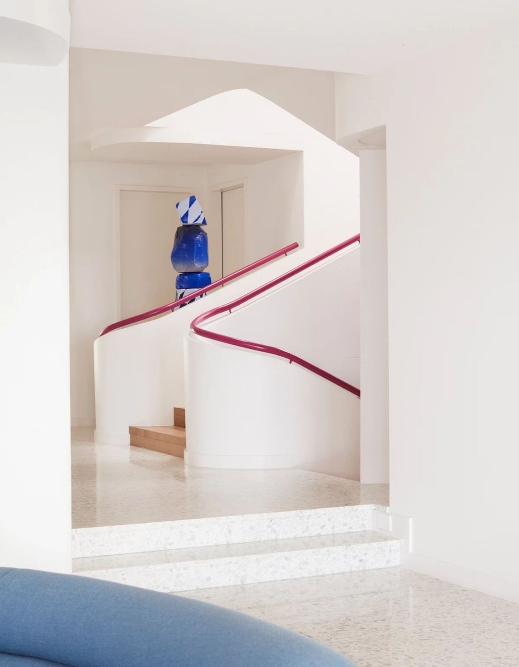 The magenta handrail can be seen on all three levels of the home.