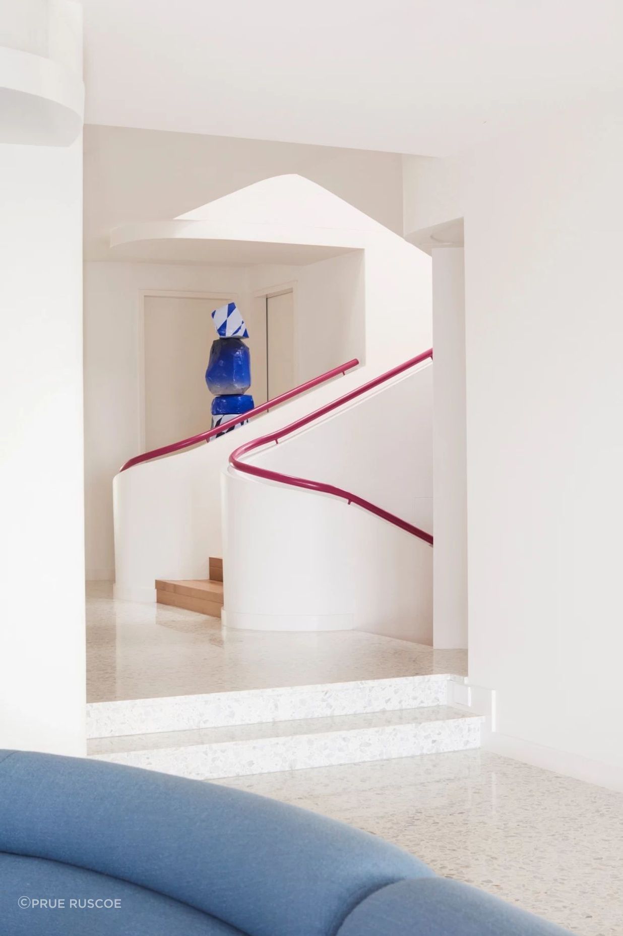 The magenta handrail can be seen on all three levels of the home.