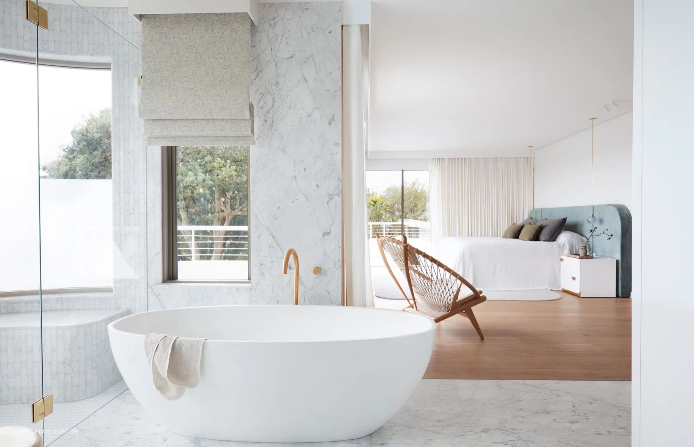 Open and airy, the main bedroom suite is a parents-only haven.