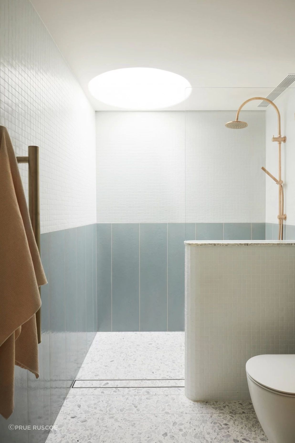 A round skylight in the 'blue' bathroom lets in natural light.