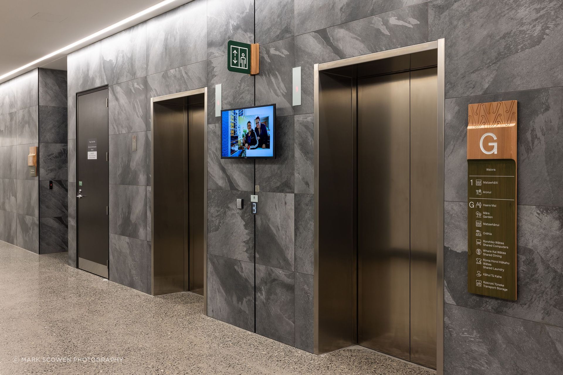 The lift lobbies feature wall tiling which continues through to the ground floor elevator landings.