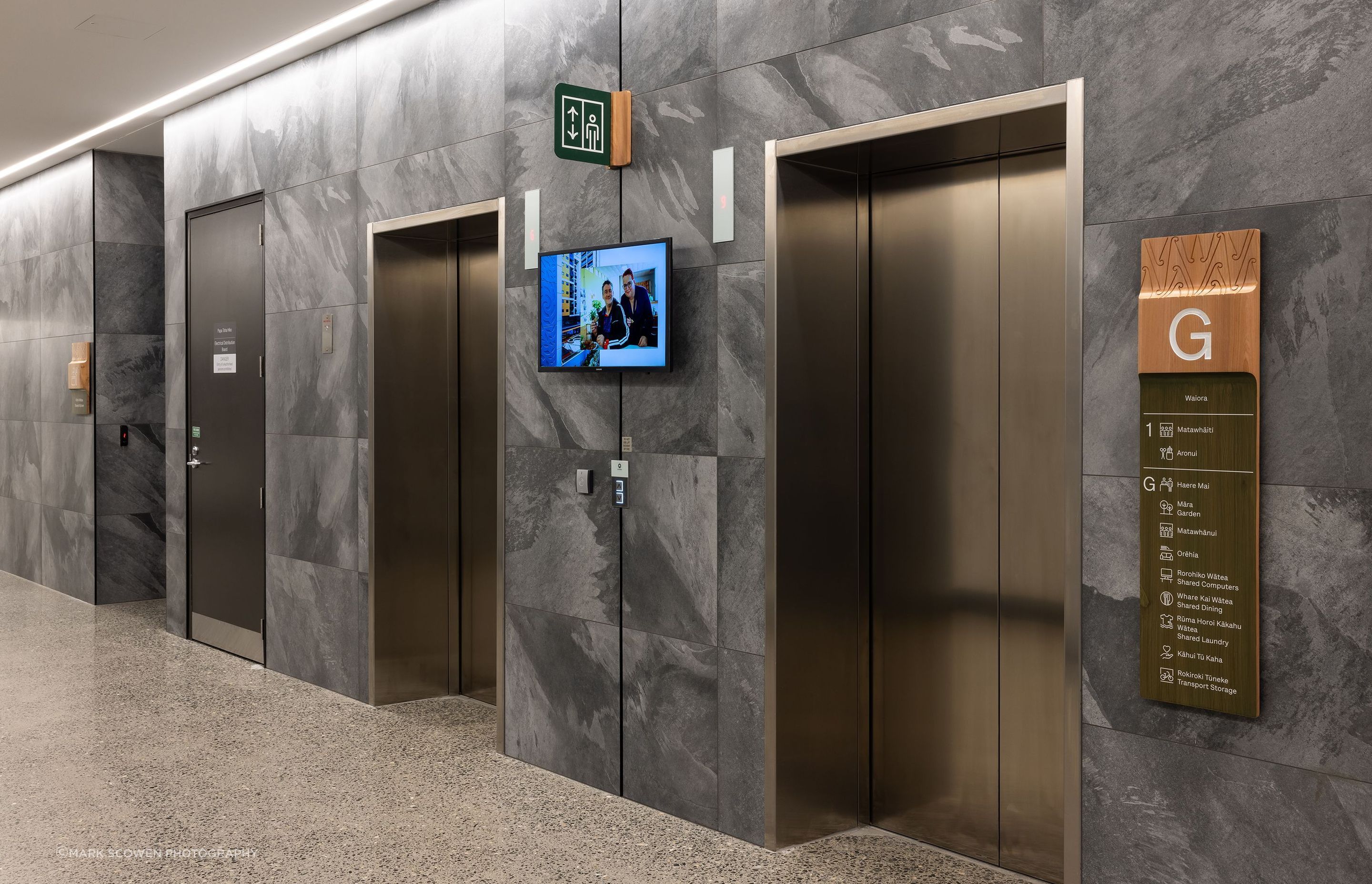 The lift lobbies feature wall tiling which continues through to the ground floor elevator landings.
