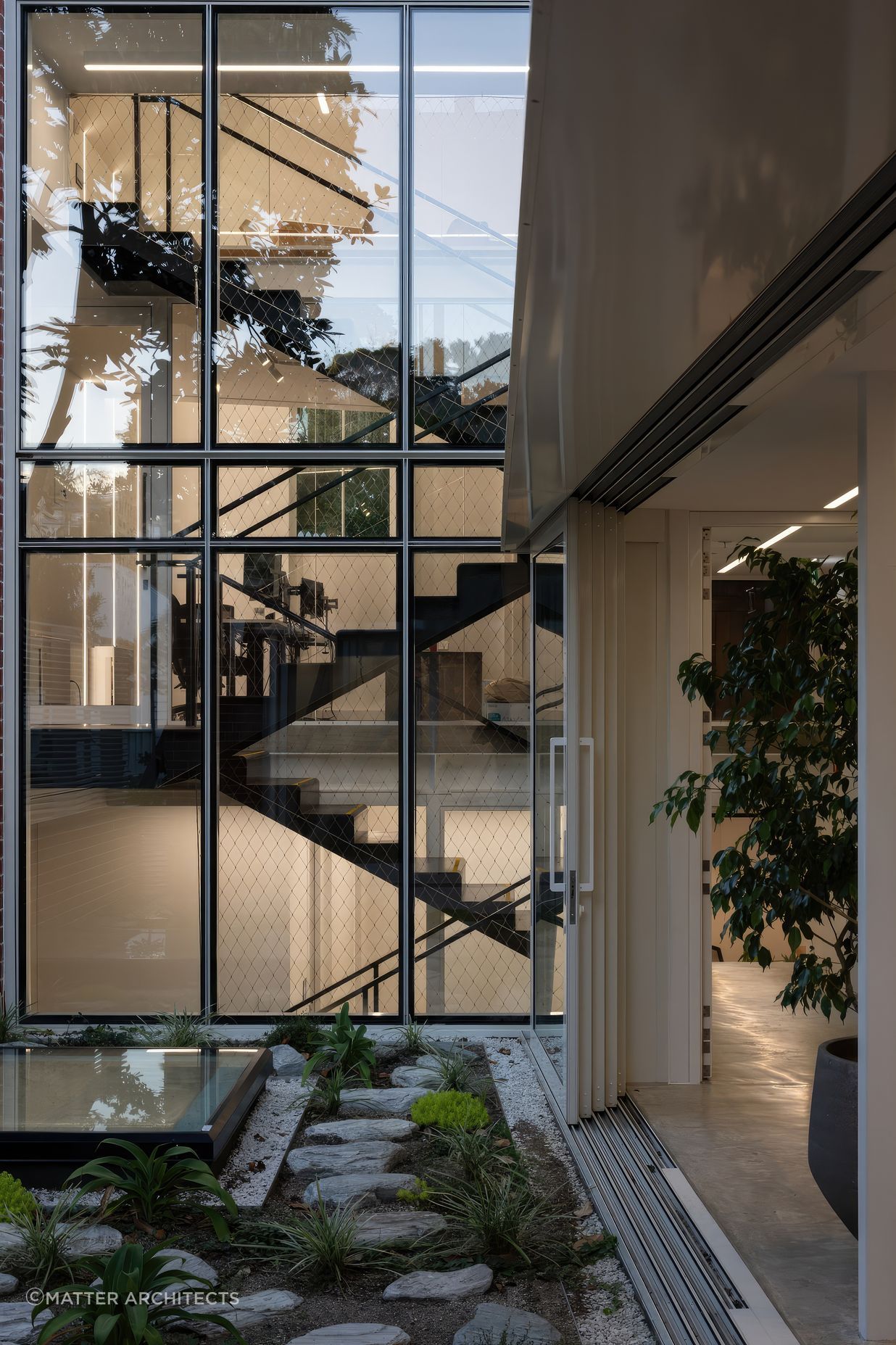 Inside the villa, a new stairway links the original building to its new extension.