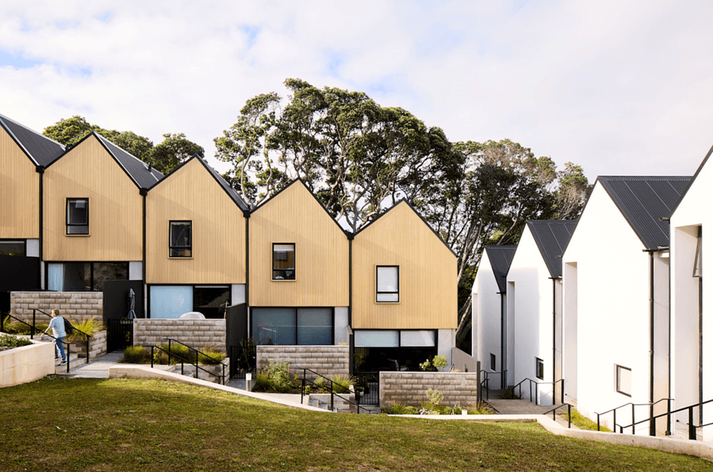 Terraced townhouses step down the site, and feature an asymmetrical roof pitch.