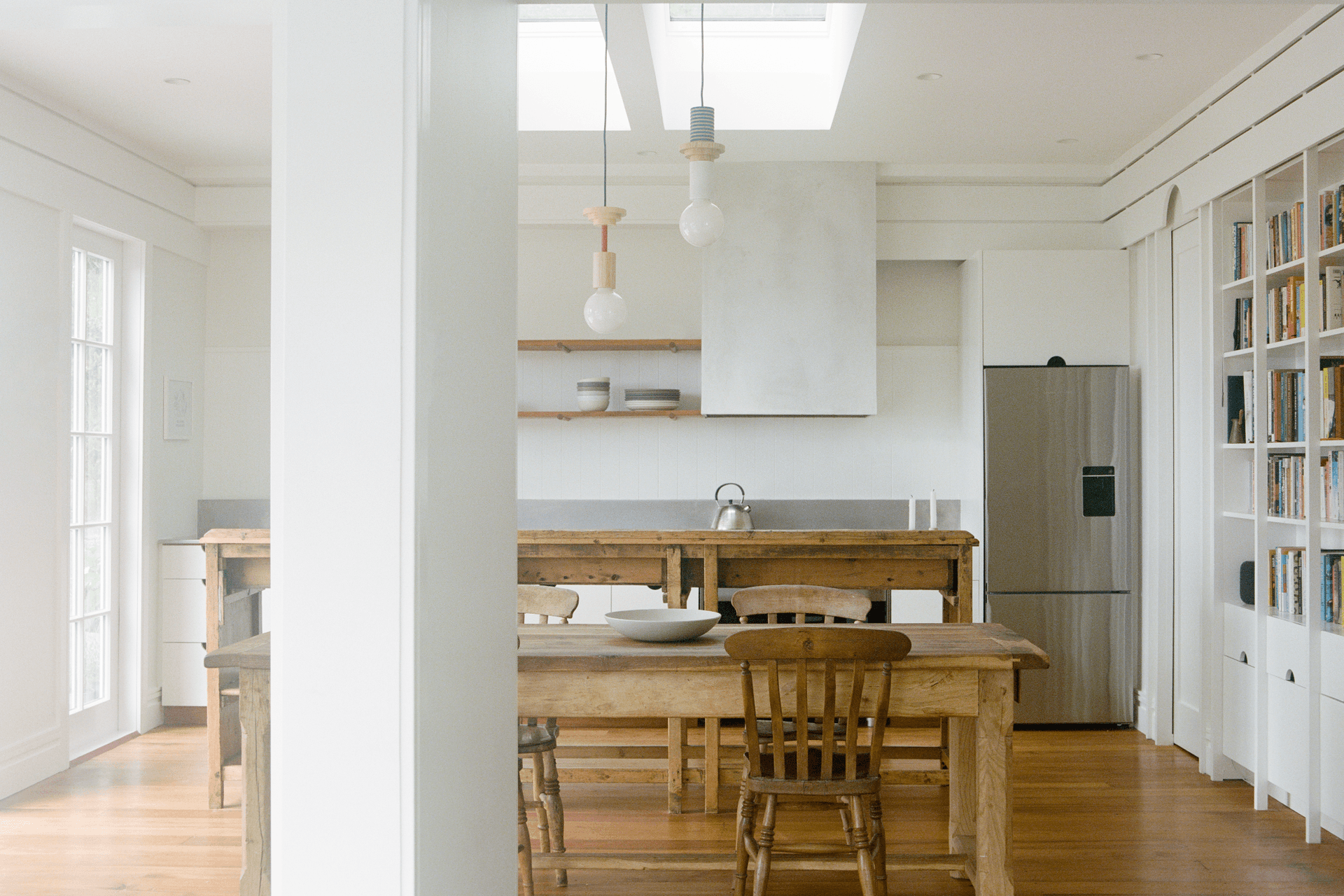 The new kitchen is flooded with lights and connects with the harbour views.