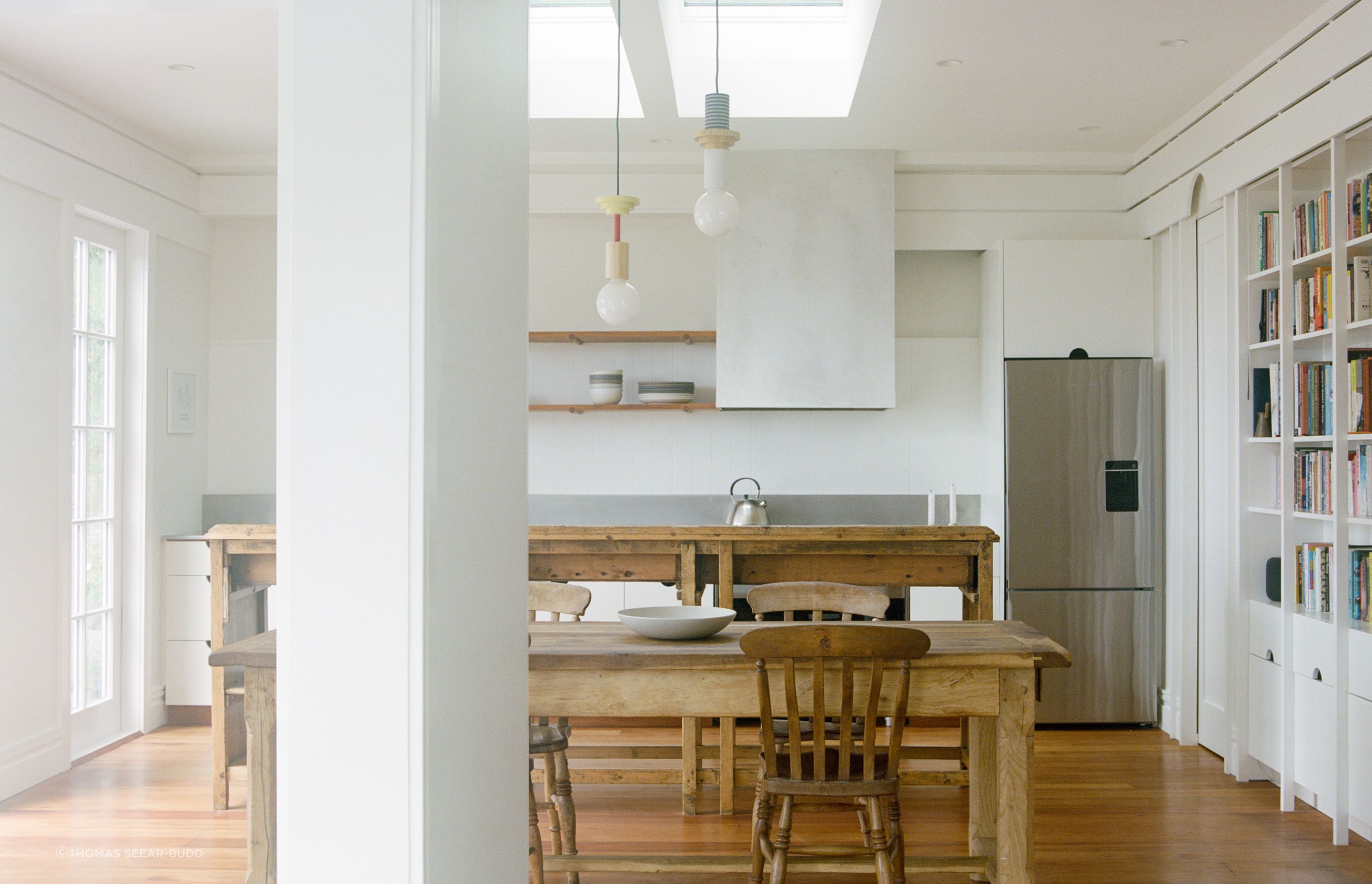 The new kitchen is flooded with lights and connects with the harbour views.