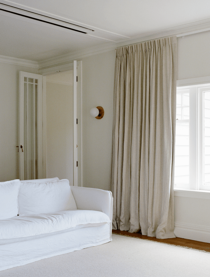 The lounge space features the dreamy natural palette the family loves.