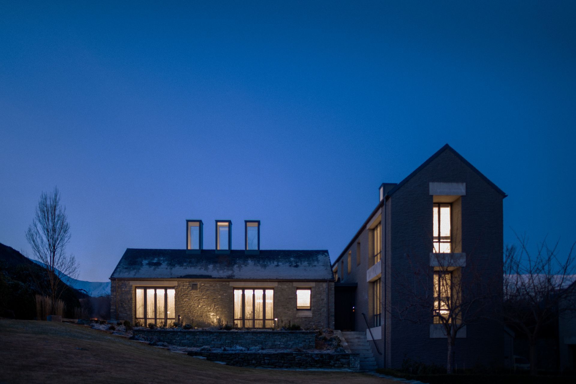 The original building, built in the early-2000s references the early stone buildings found in the area, and was unchanged in the refurbishment, apart from the front door, which was replaced with a more substantial door, befitting the architecture.