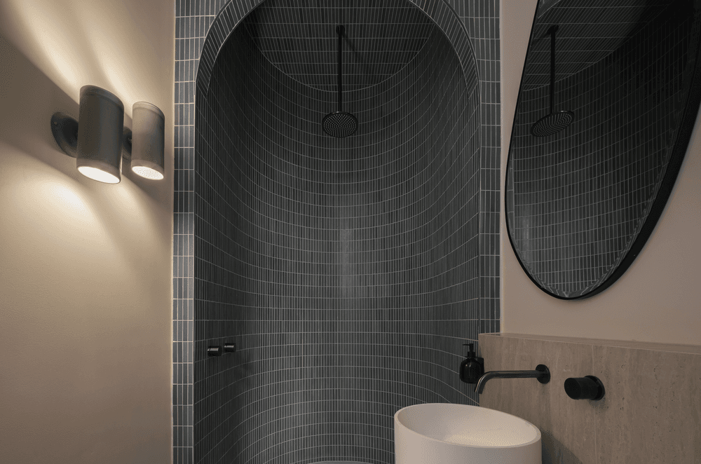 Handmade tiles add colour and texture to the downstairs bathroom.