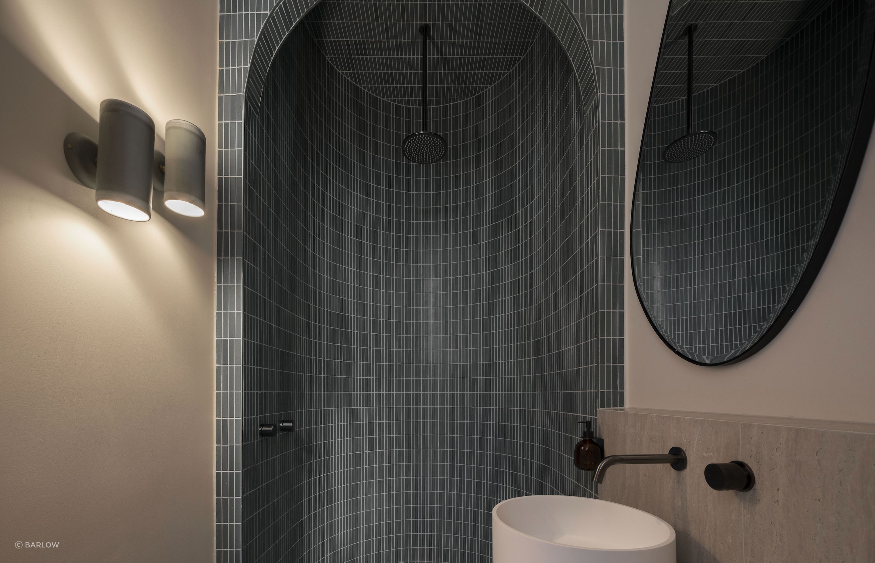 Handmade tiles add colour and texture to the downstairs bathroom.