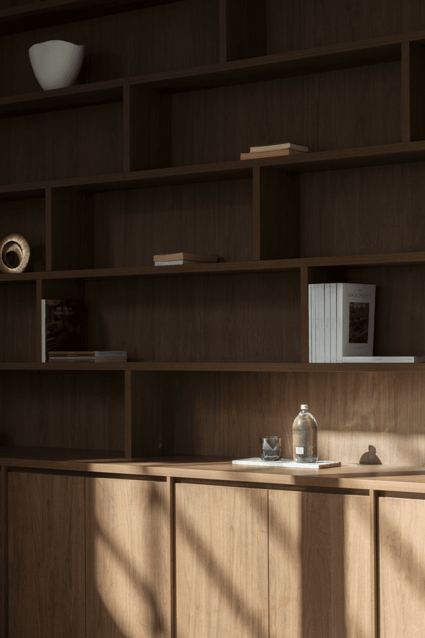 The same dark timber as the kitchen cabinetry has been selected for the study.