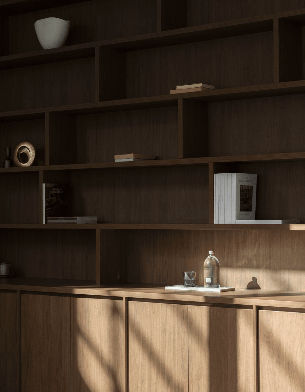 The same dark timber as the kitchen cabinetry has been selected for the study.