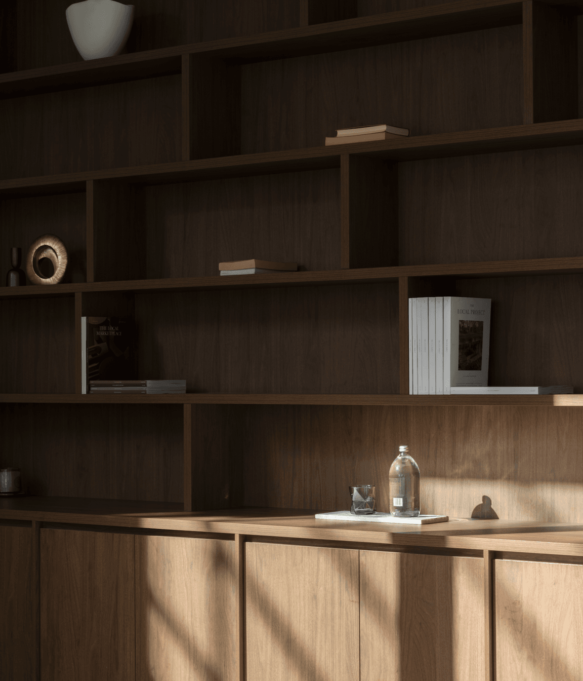 The same dark timber as the kitchen cabinetry has been selected for the study.