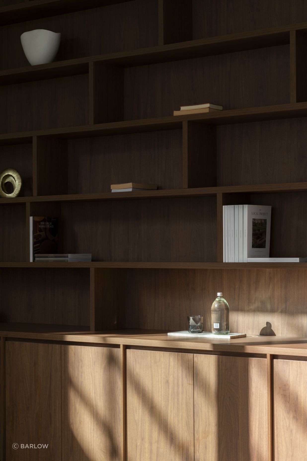 The same dark timber as the kitchen cabinetry has been selected for the study.