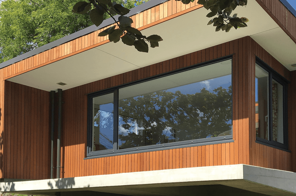 uPVC windows and doors come in a range of sizes up to 2.8m by 10m and are available in a range of 45 standard and factory-applied laminate colours—including anthracite grey (pictured)—and various timber-look textures.