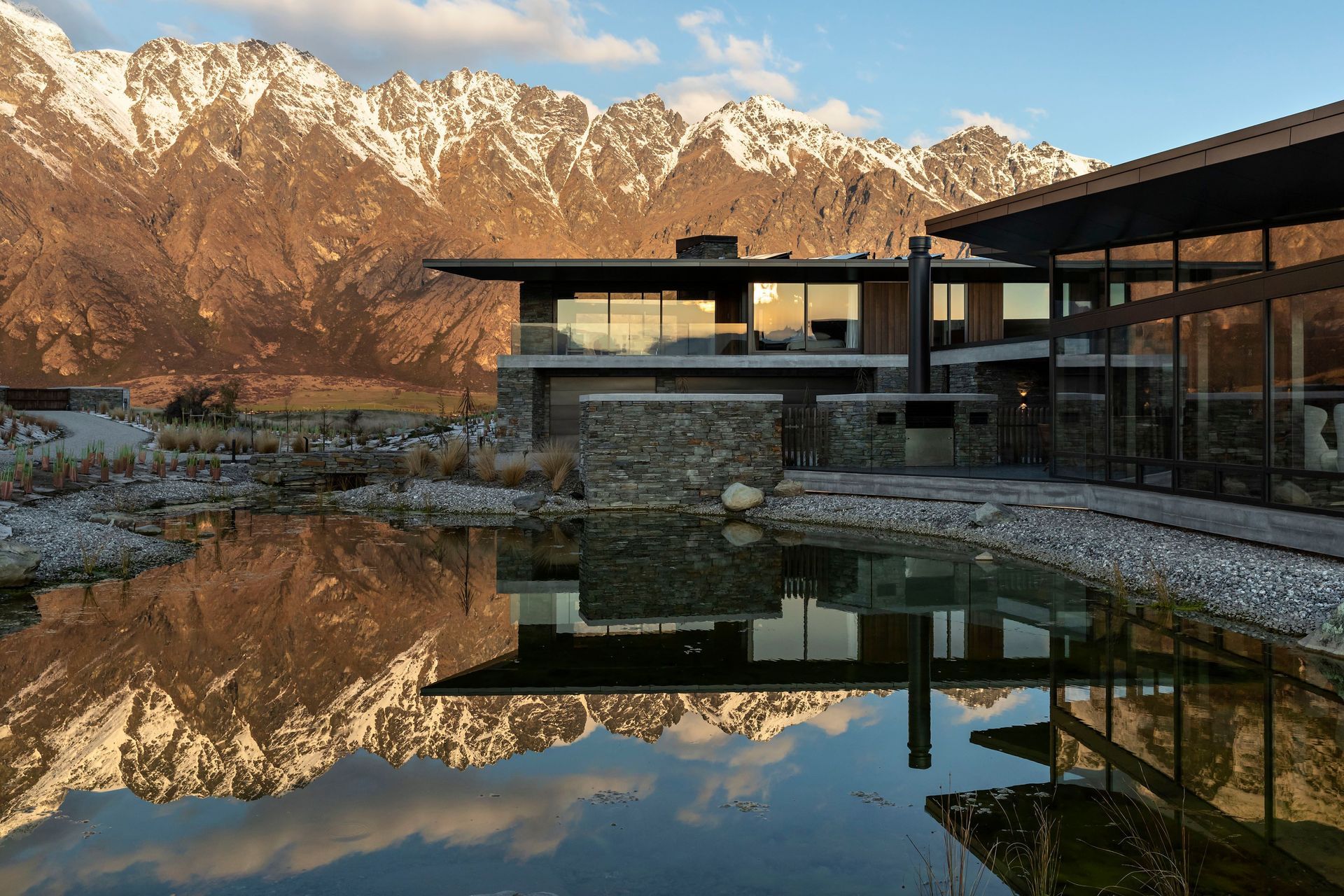 A view from the reflection pool of Hidden Island Retreat and the surrounding mountain ranges.